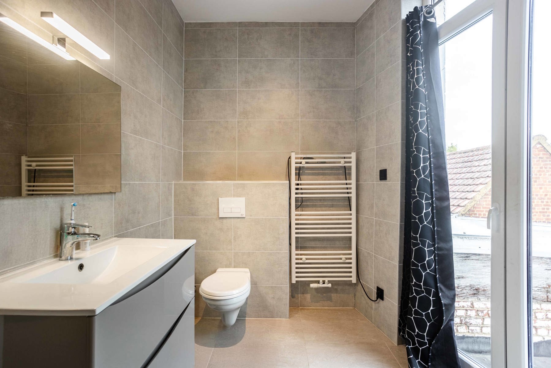 Gerenoveerde stadswoning met tuin en 3 SLP foto 18