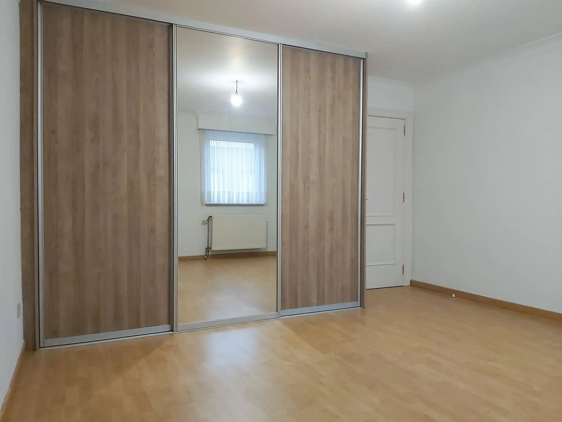 Gelijkvloers appartement met 2 slaapkamers, autostaanplaats en kelderberging in Maasmechelen! foto 10