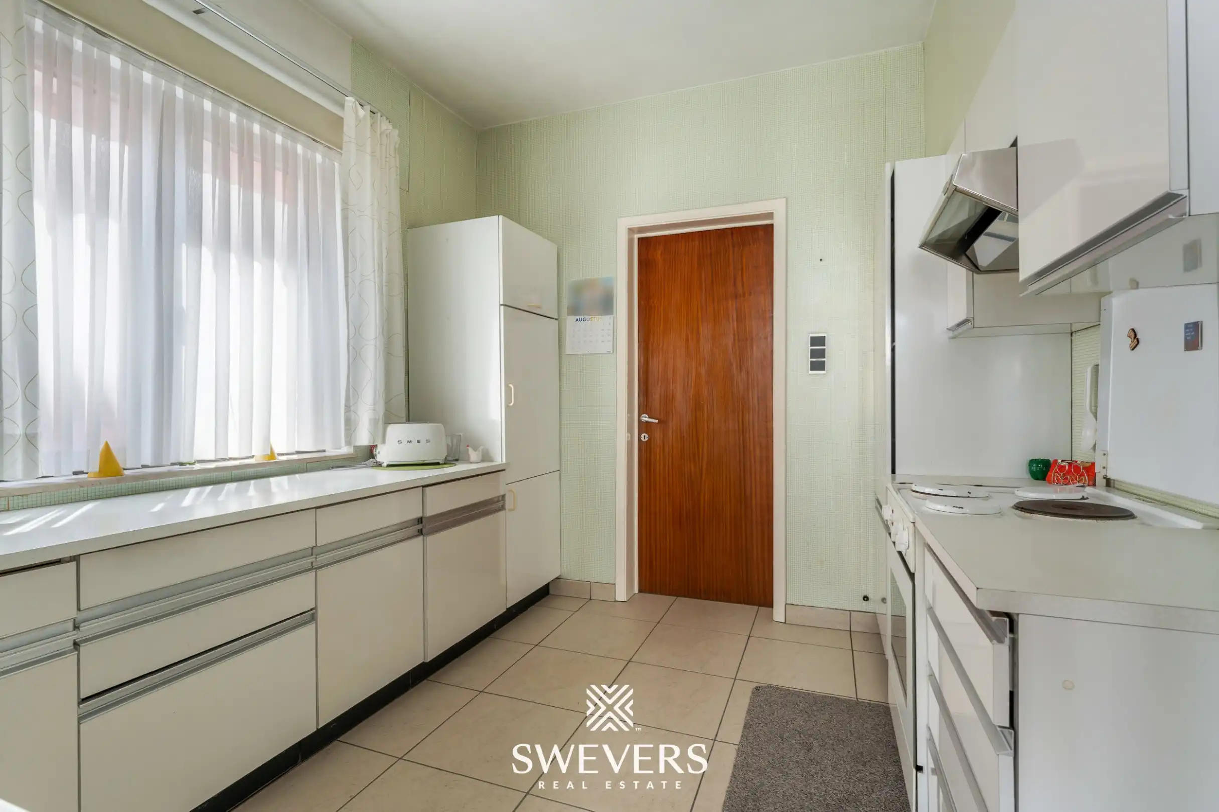Statige woning met veel potentieel in het centrum van Diepenbeek foto 12