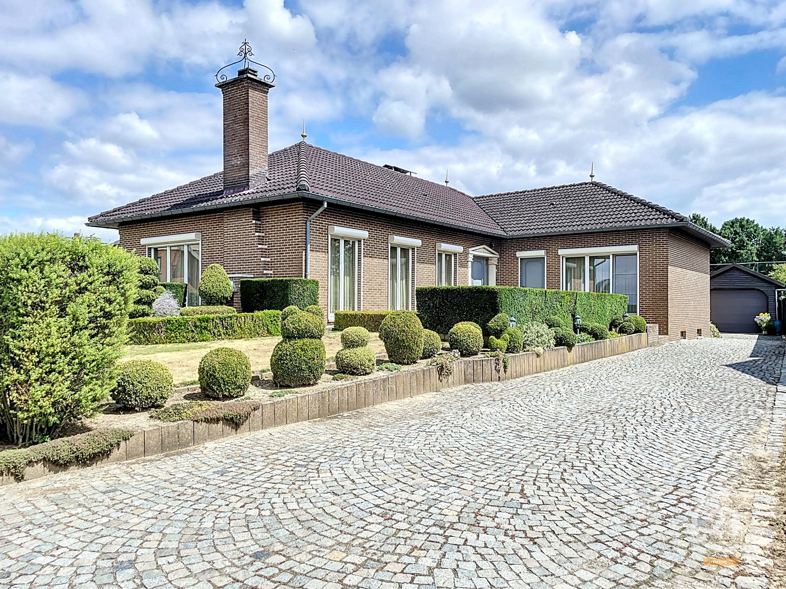 Hoofdfoto van de publicatie: Degelijke en onderhouden gelijkvloerse woning met werkhuis
