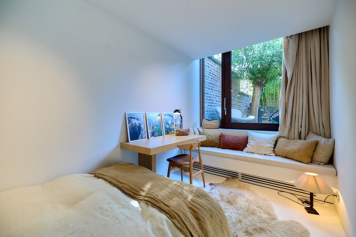 Buitengewone interbellum architecten-burgerwoning met tuin die omgevormd werd tot een hedendaagse luxueuze concept-woning. foto 17