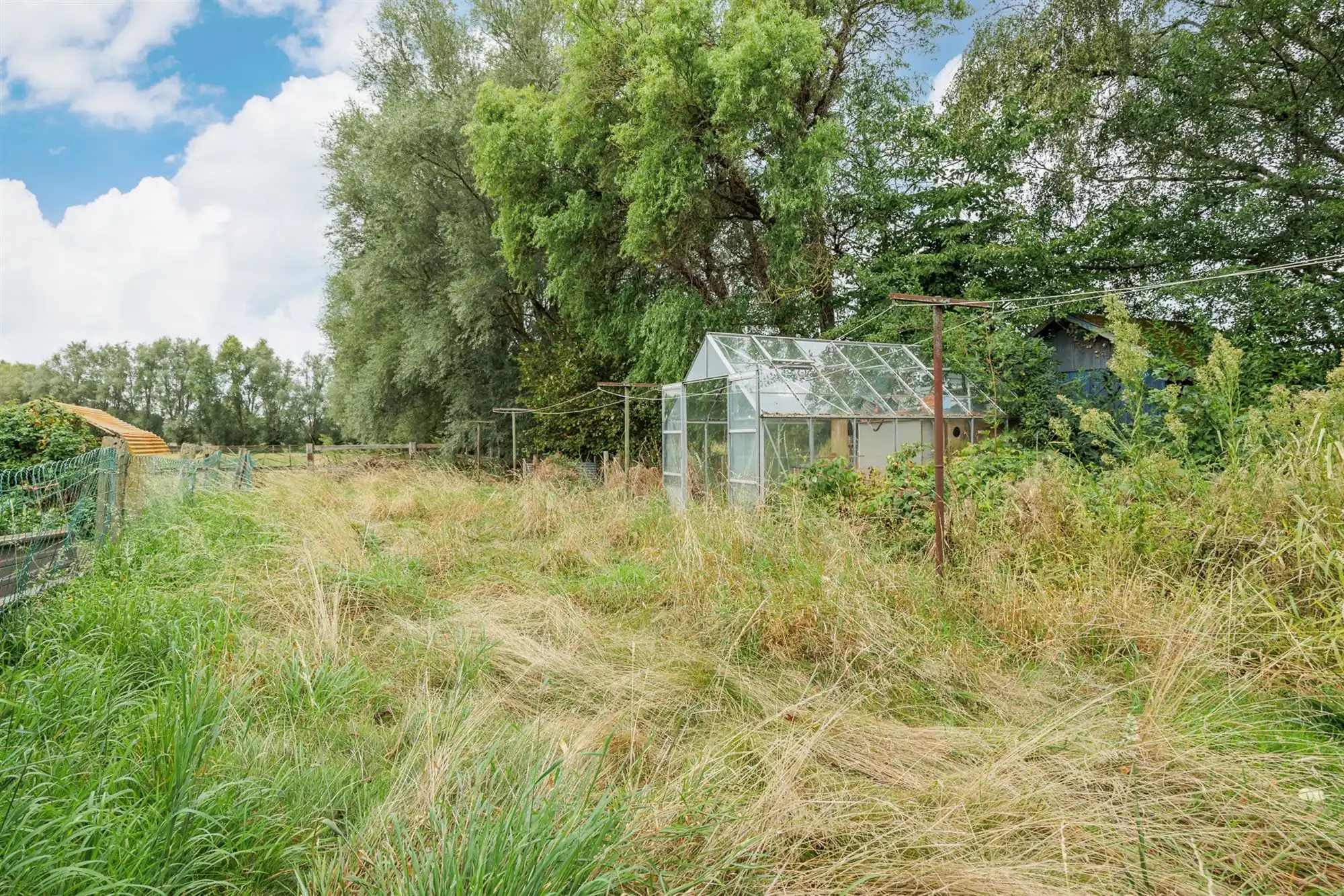 Te renoveren woning met garage, oprit en tuin foto 19