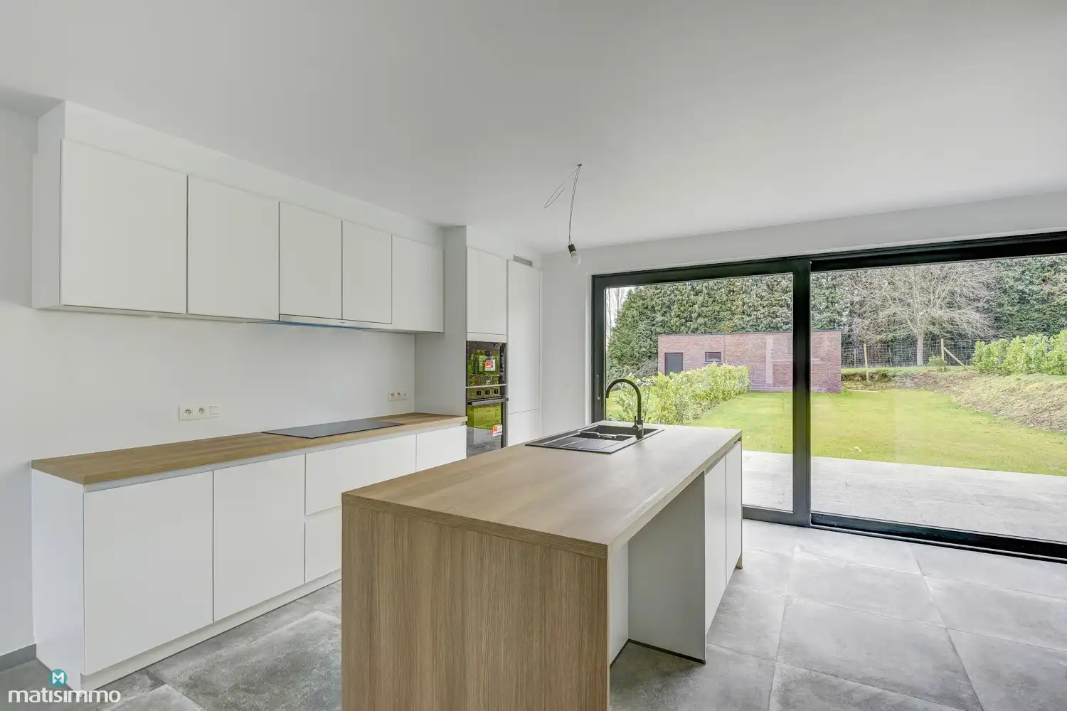 VOLLEDIG AFGEWERKTE EN GESCHILDERDE NIEUWBOUWWONING (EPB E10) MET 3 SLAAPKAMERS, 2 BADKAMERS, 2 GARAGES, KELDER EN AANGELEGDE TUIN IN WERM foto 10
