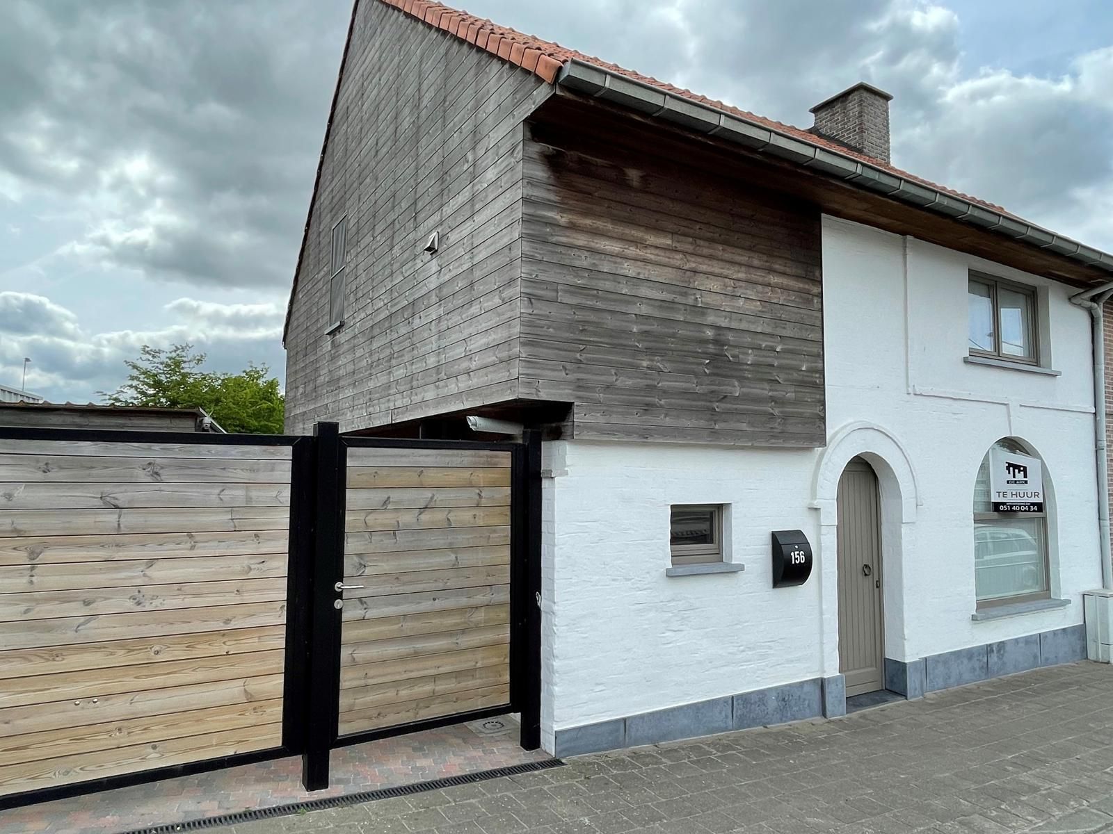 Instapklare woning met oprit, garage en zuidgerichte tuin foto 3