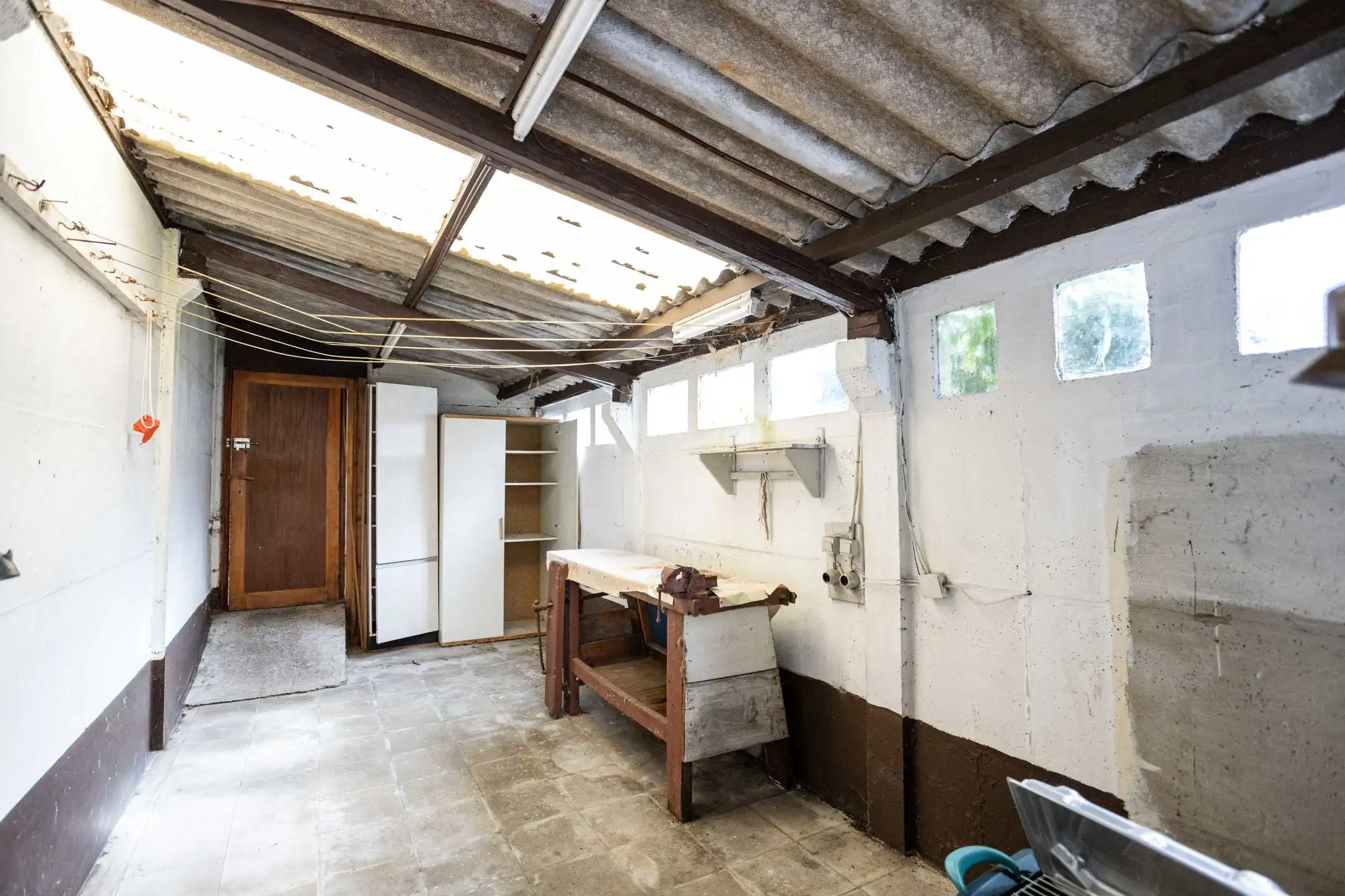 Te renoveren woning met aangename stadstuin foto 20