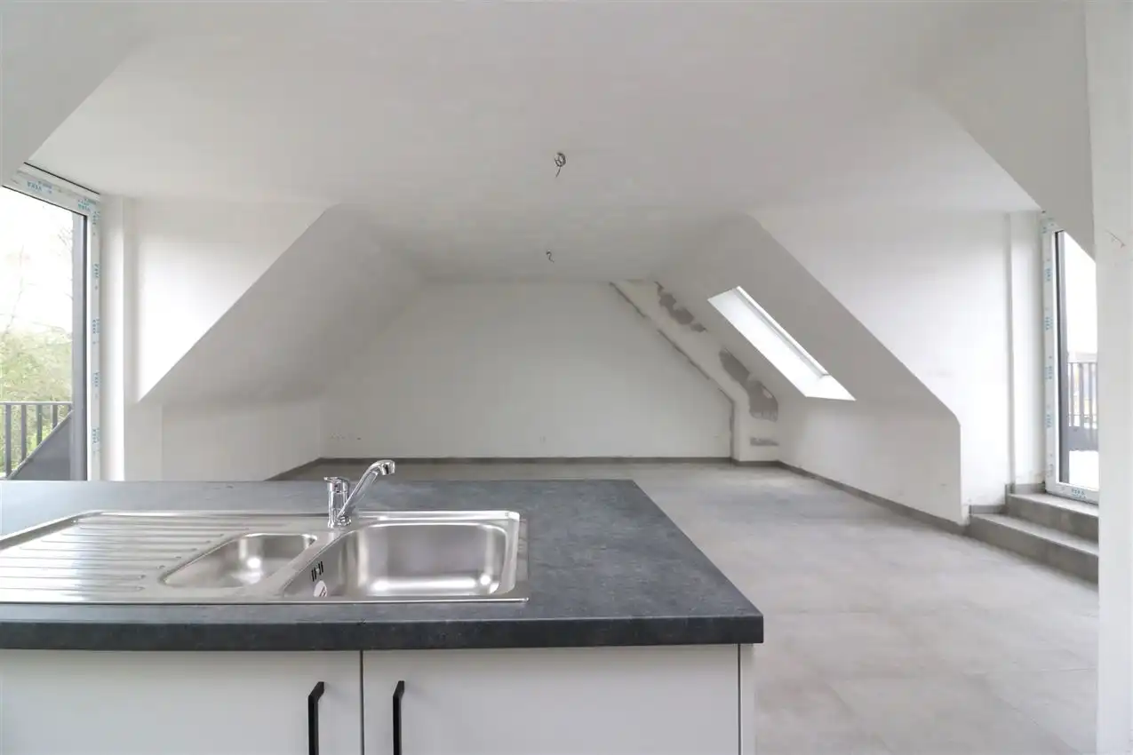 Uniek penthouse in centrum Aarschot met 1 slpk. parking en terras foto 4