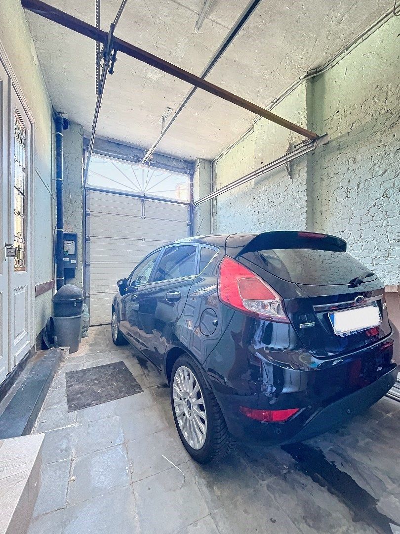Unieke ruime stadswoning met verzorgde tuin, garage en 4 slaapkamers in Tienen. foto 16