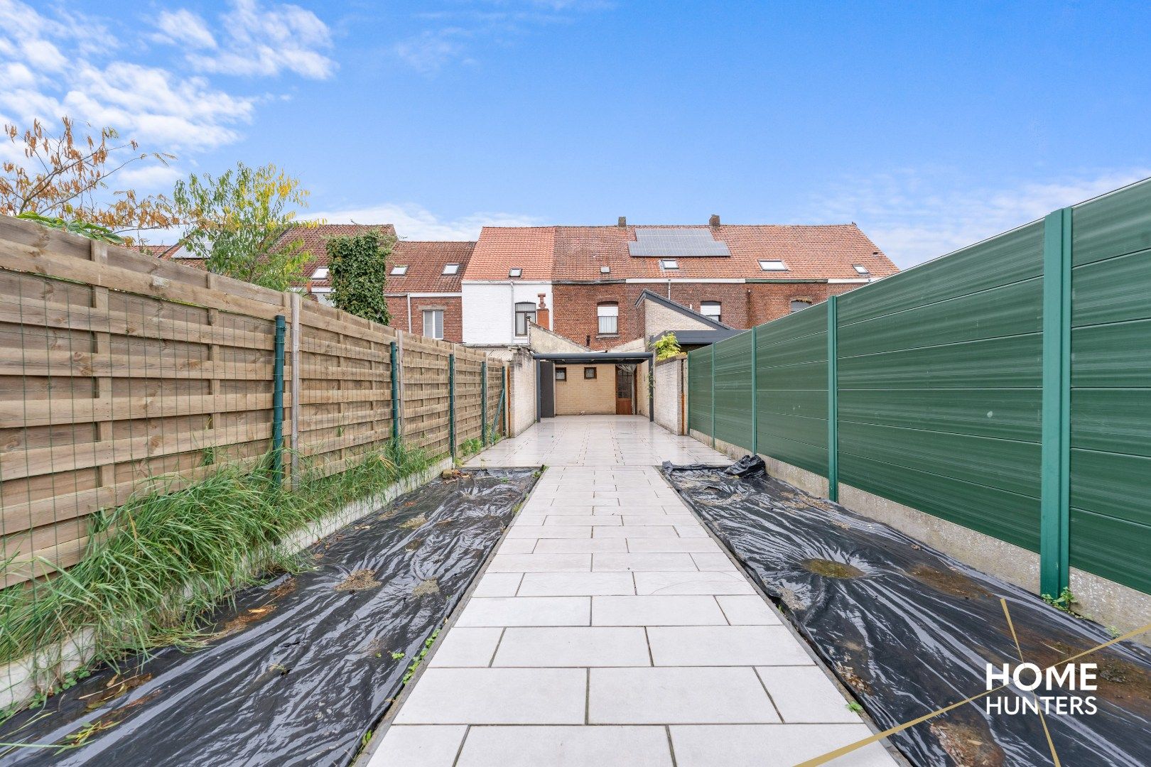 Charmante te renoveren rijwoning met 3 slaapkamers en diepe tuin op centrale ligging in Menen foto 25