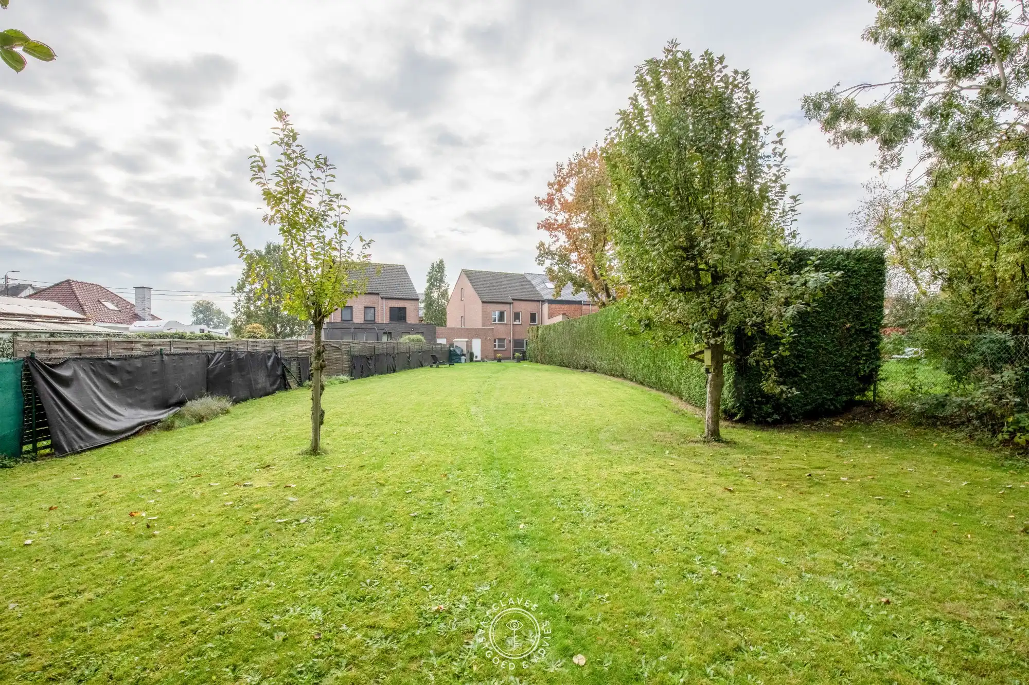 Instapklare gezinswoning met 3 slaapkamers, garage en verrassend ruime tuin in Sint-Niklaas foto 3