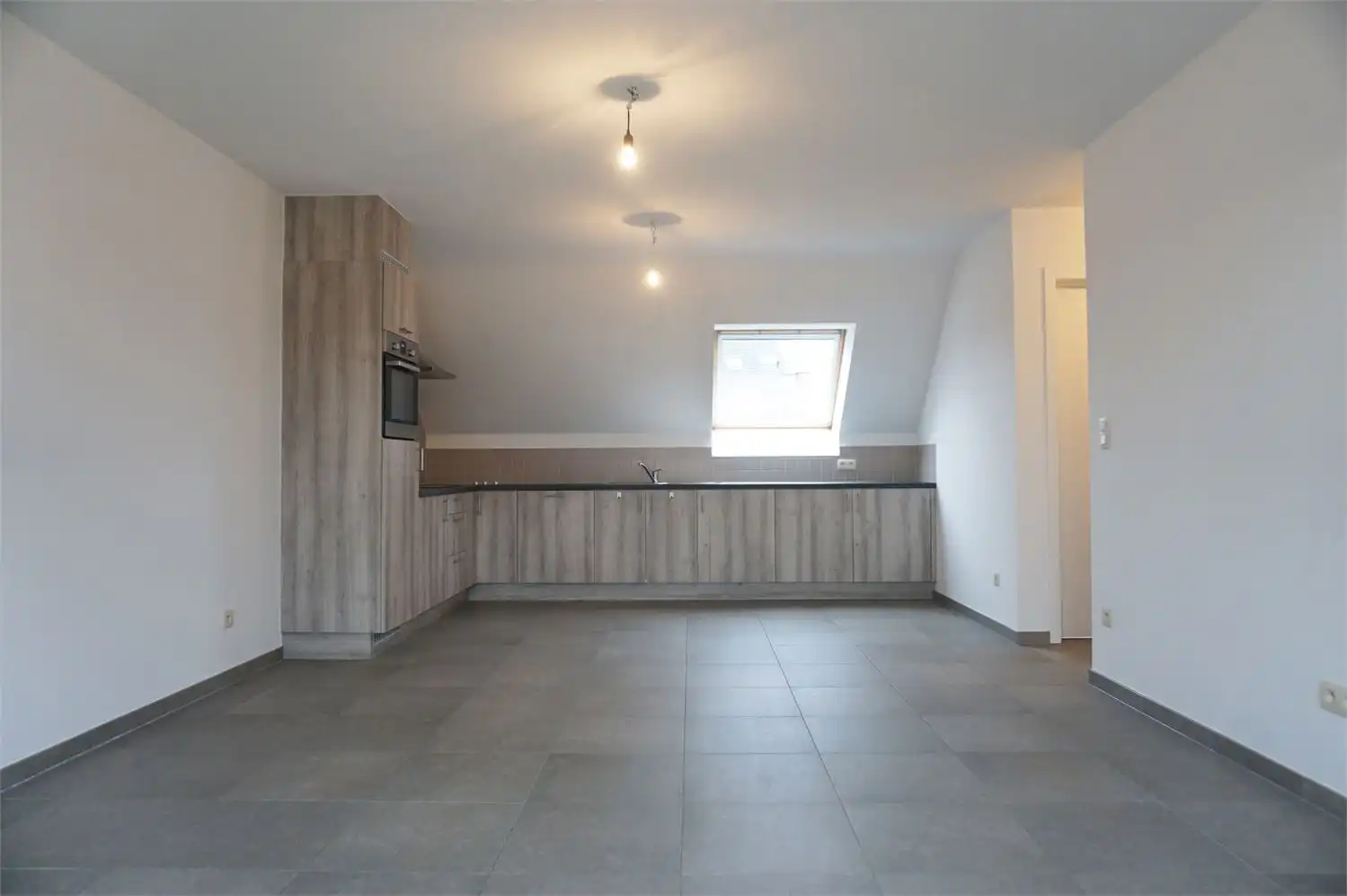 Duplex appartement met terras, 2 slaapkamers en dubbele autostaanplaats in centrum Paal foto 3