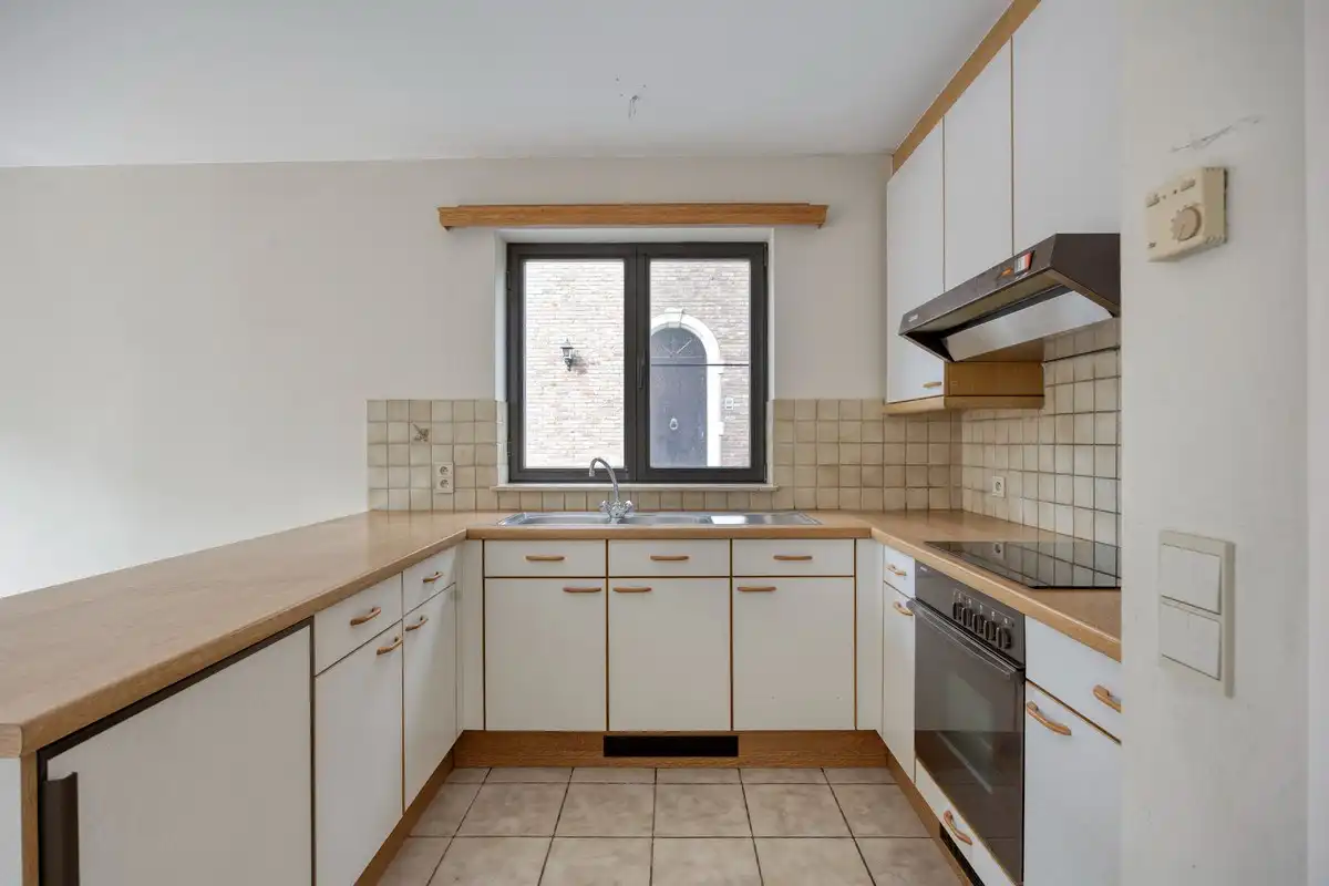 Opbrengsteigendom met 3 appartementen en 7 garages foto 9