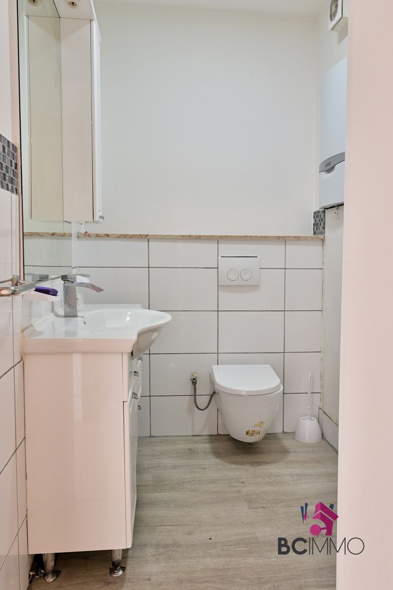 Handelswoonst met een triplex appartement te koop in Genk foto 8