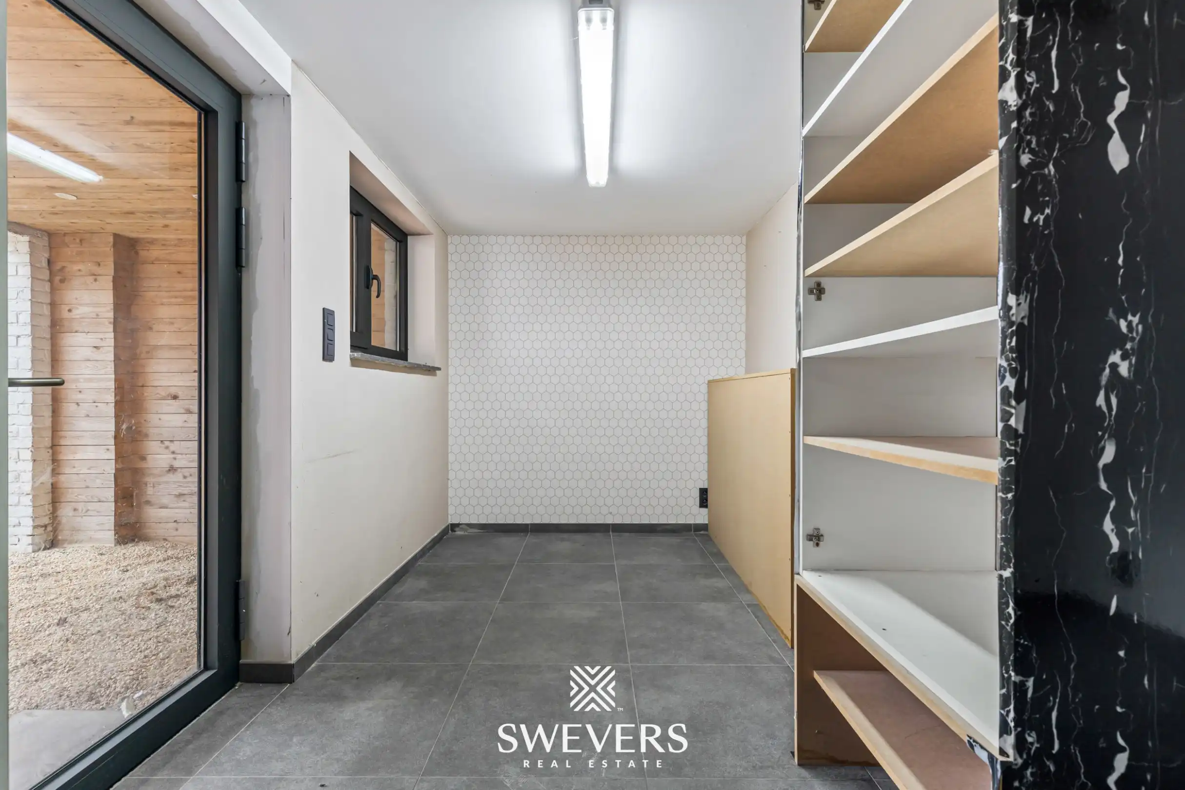 Instapklare en energiezuinige rijwoning met tuin, terras en garage in hartje Leopoldsburg foto 23