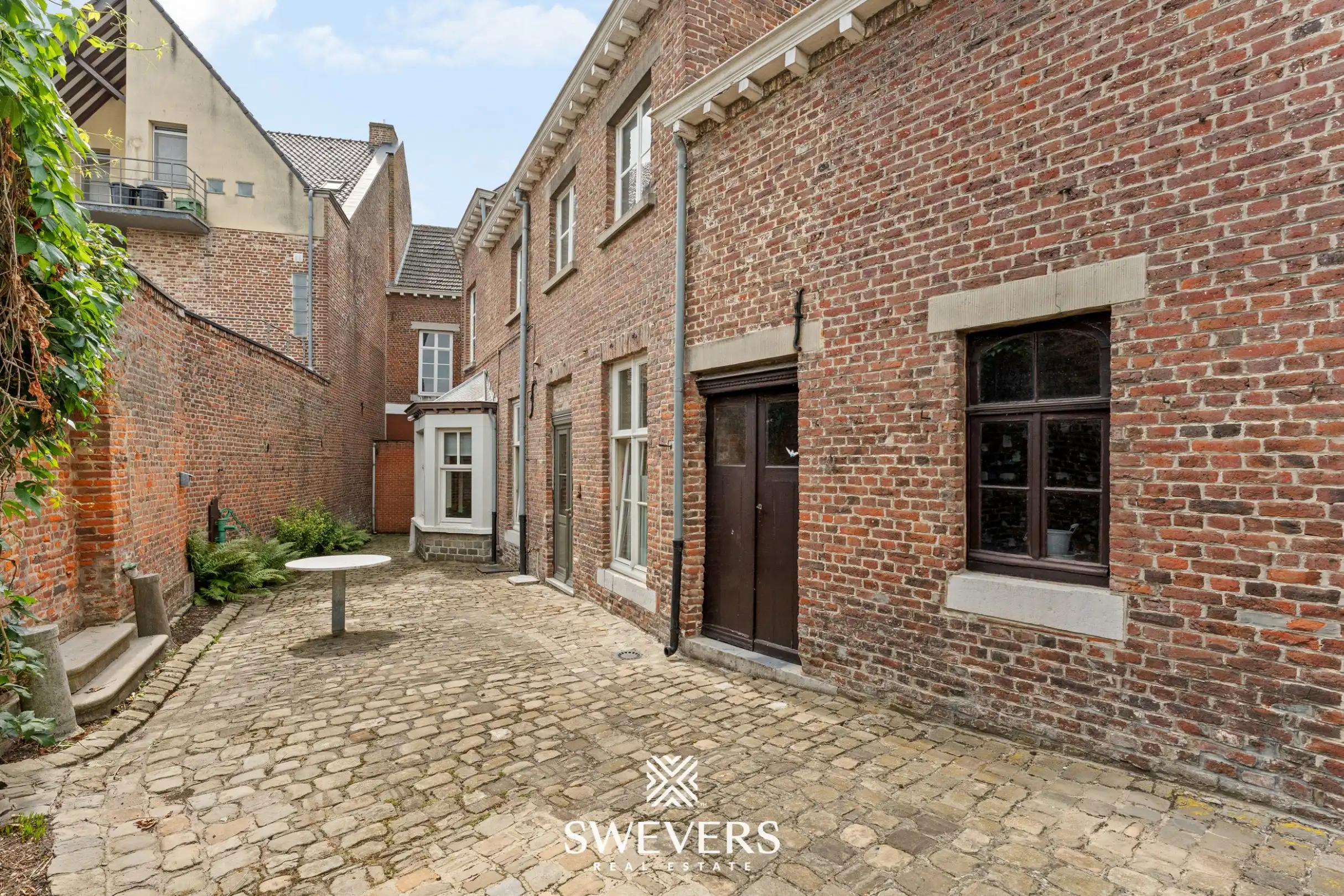 Karaktervol herenhuis met 346 m² woonruimte en uitzonderlijk renovatiepotentieel in centrum Borgloon foto 47