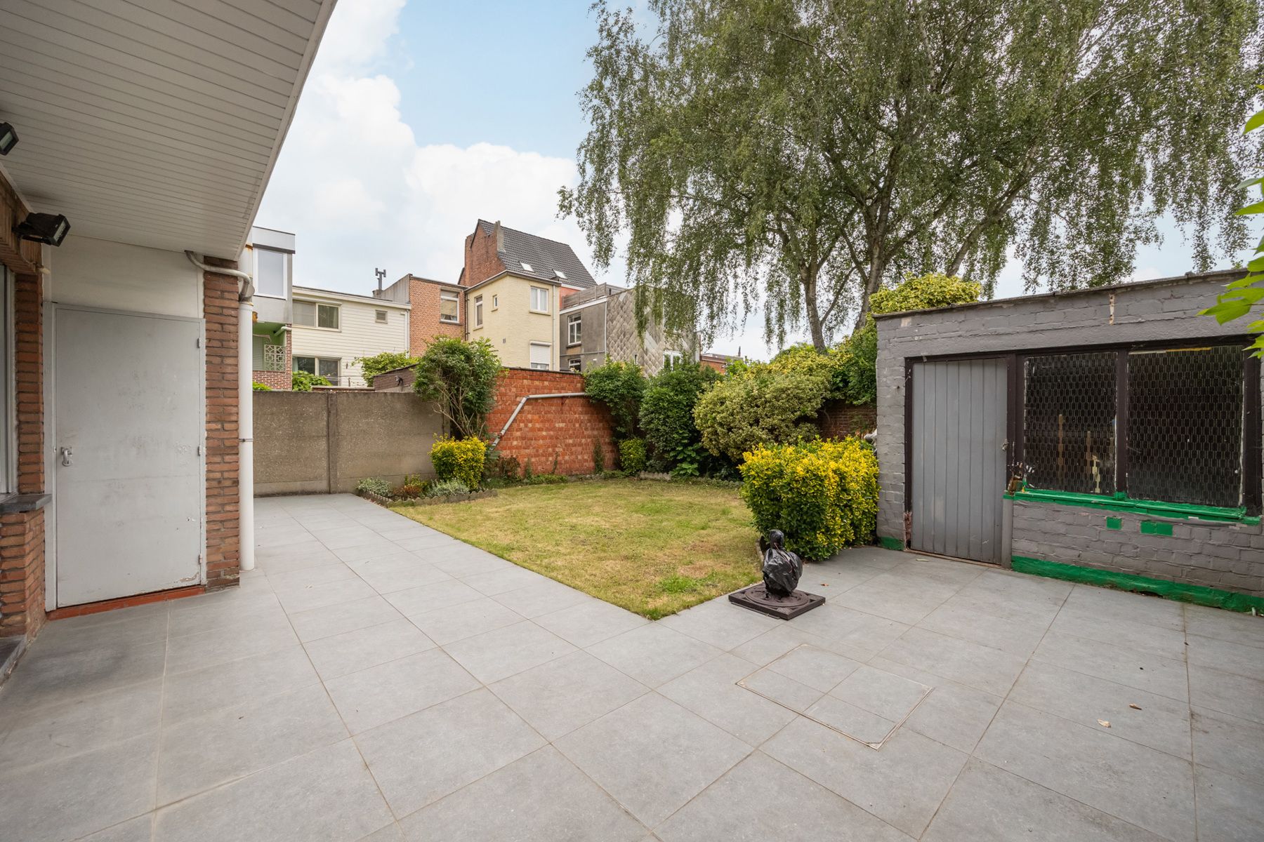 Uniek gelijkvloersappartement met 2 à 3 slpks en grote tuin foto 3