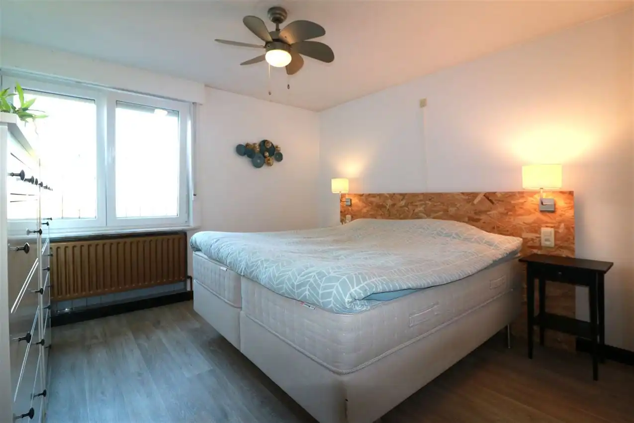 Gusting gelegen woning met 2 slpk, garage en tuin foto 16