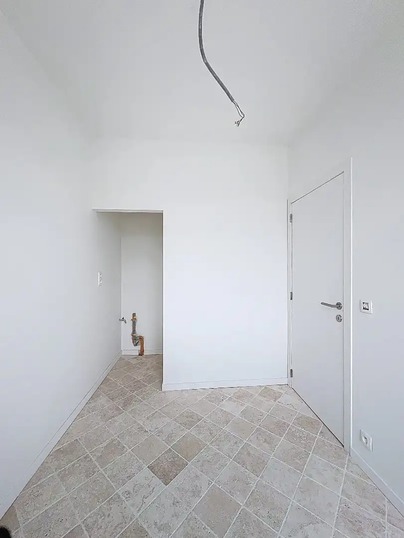 Elegant wonen in Tienen: gerenoveerde rijwoning met 3 slaapkamers en zuidwestgerichte tuin. foto 2