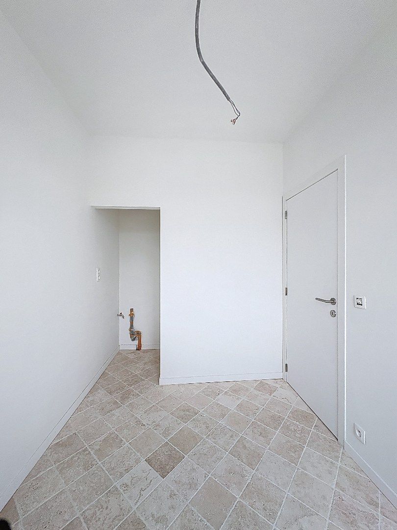 Elegant wonen in Tienen: gerenoveerde rijwoning met 3 slaapkamers en zuidwestgerichte tuin. foto 2