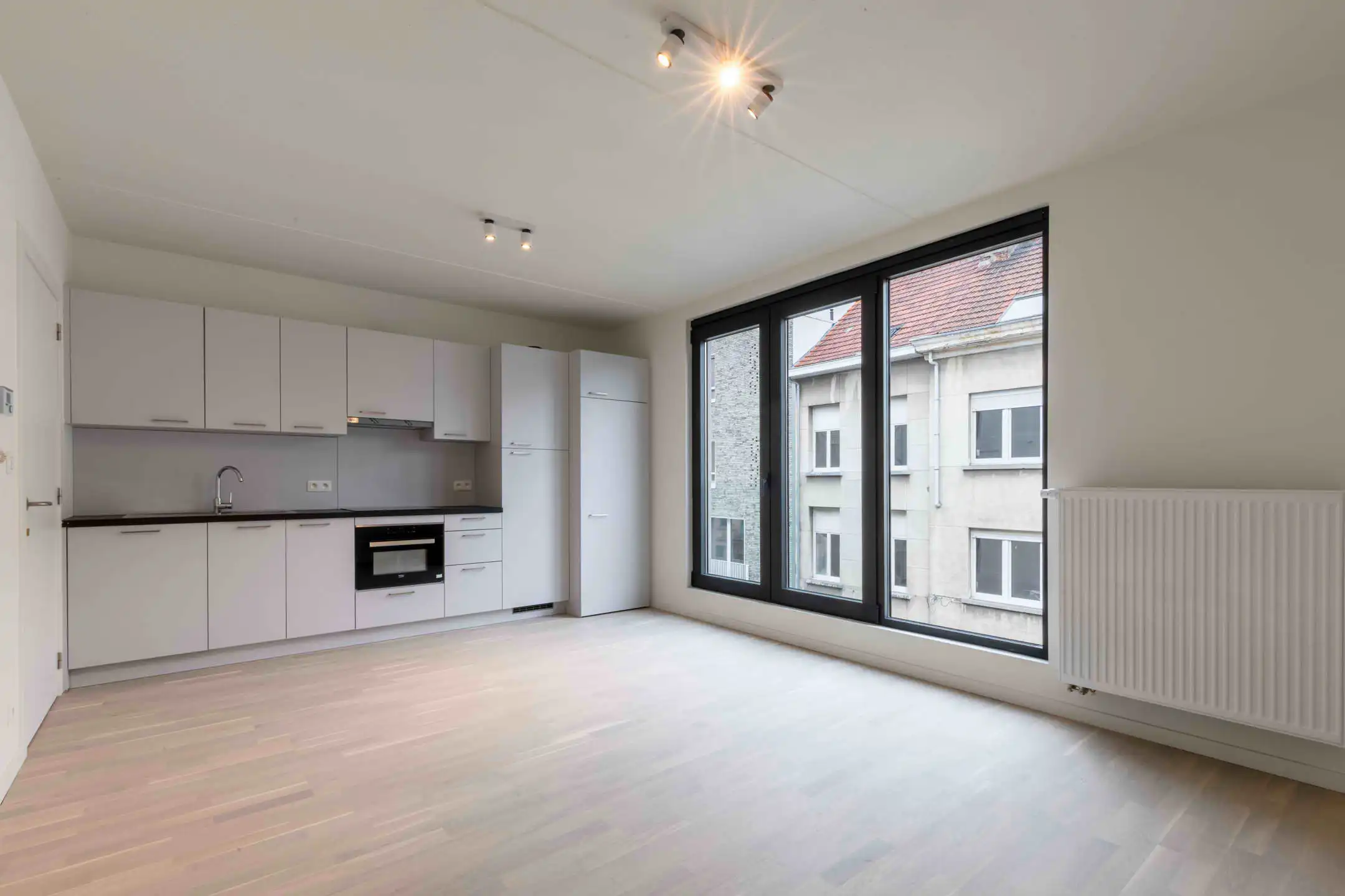 Modern 1-slaapkamerappartement met zuidgericht terras foto {{pictureIndex}}