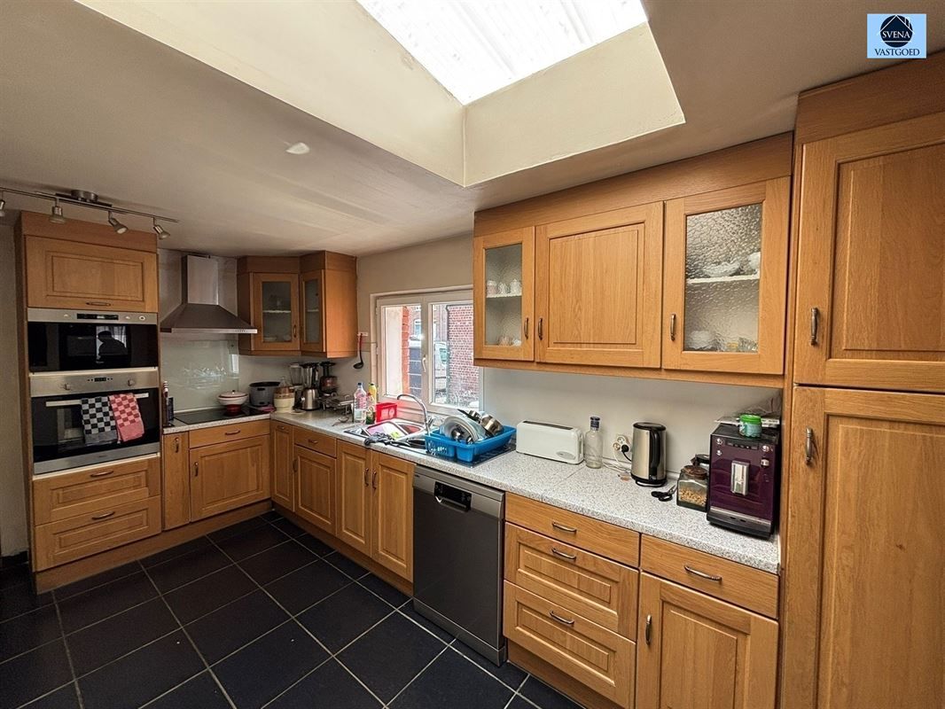 WONING MET 5 SLAAPKAMERS EN STADSTUINTJE. foto 2