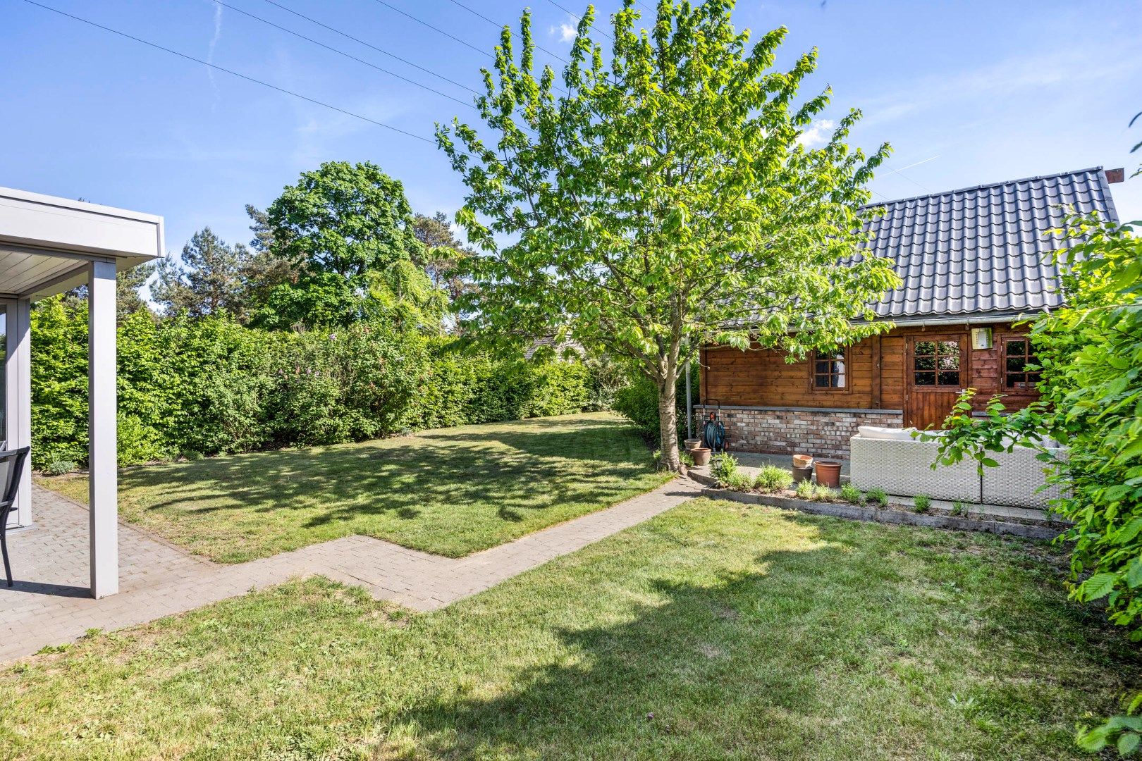 Instapklare woning met 3 SLPKS en zon georiënteerde tuin !  foto 28