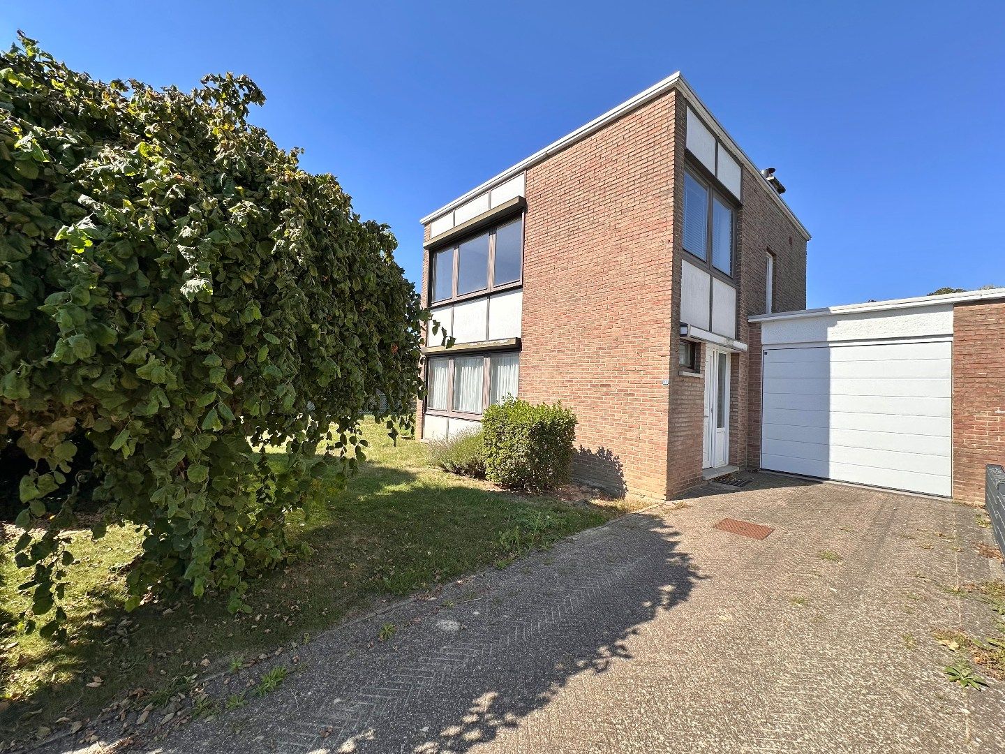 Hoofdfoto van de publicatie: Te koop: Halfopen bebouwing met 3 slaapkamers en tuin in rustige buurt te Tongeren