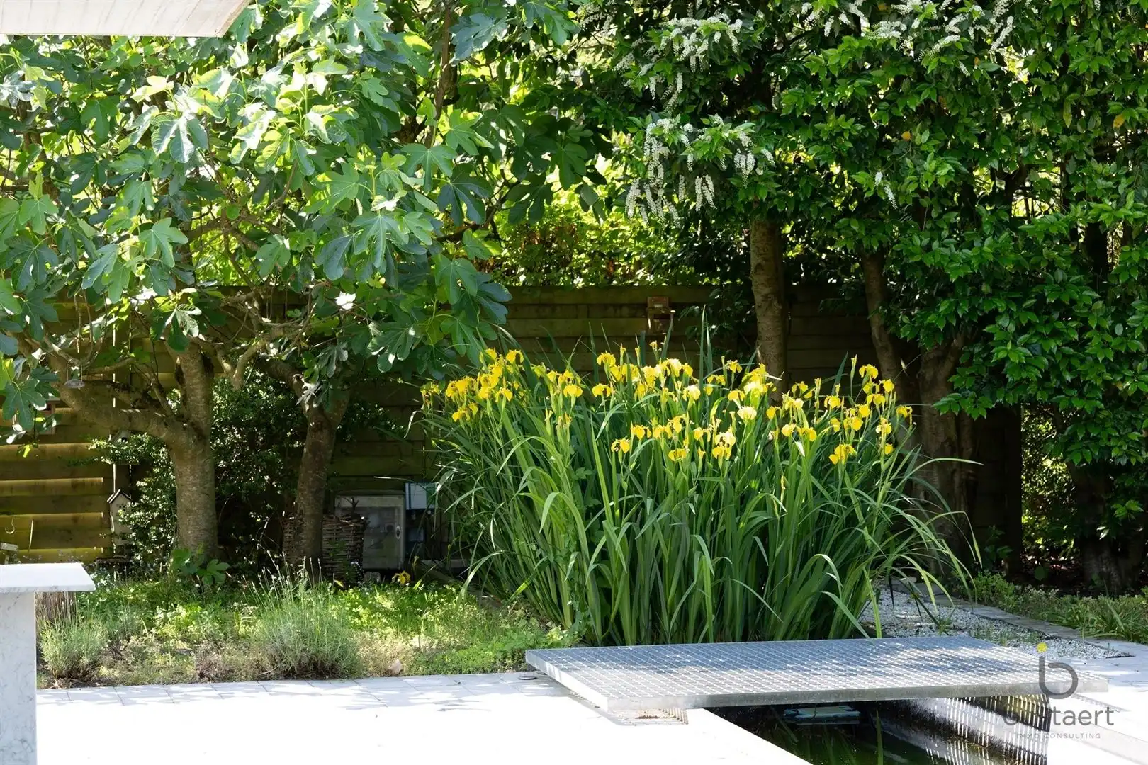 Te renoveren zonovergoten gelijkvloers 70’s woning met prachtige tuin en tal van mogelijkheden! foto 42