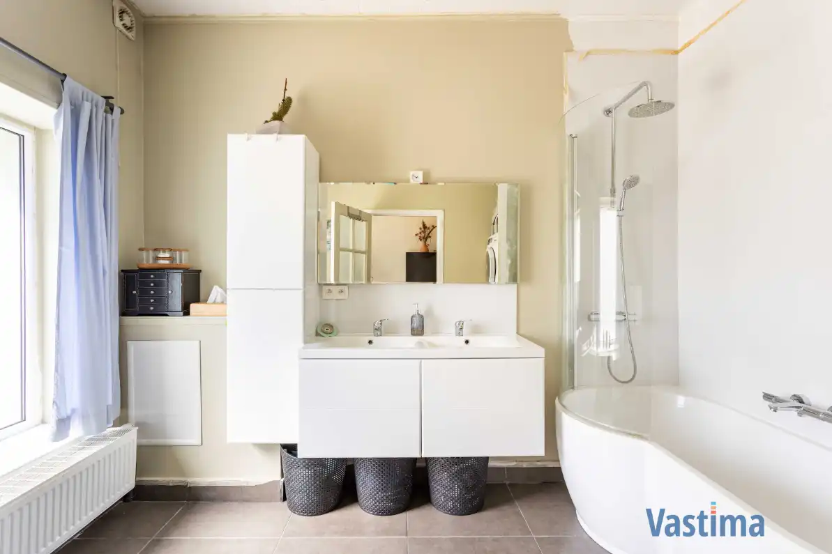 Energiezuinige en instapklare starterswoning met 2 slaapkamers in hartje Erembodegem foto 8