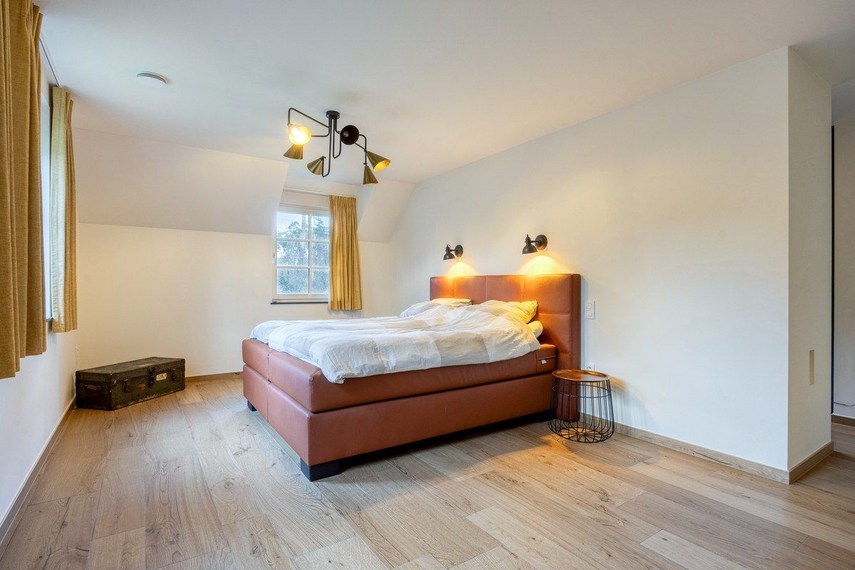 Ruim ingedeelde en kwalitatief afgewerkte villa op een mooi perceel met naastgelegen bouwgrond. foto 16