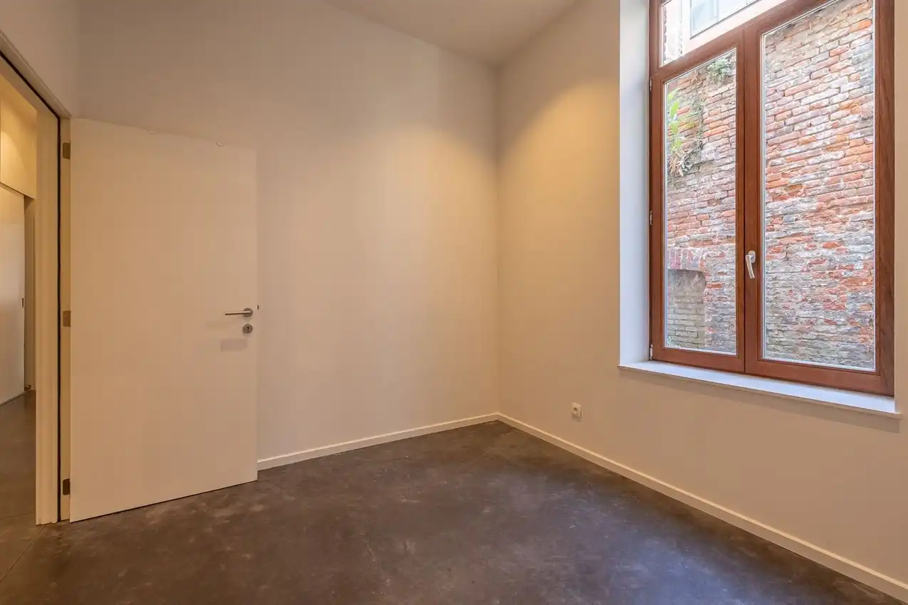 Ruim gelijkvloers appartement met zonnige tuin op toplocatie foto 22