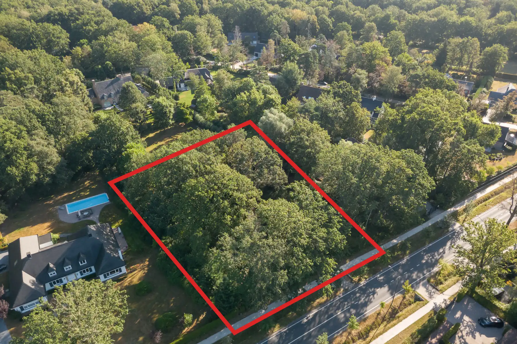 Bouwgrond van 2.247 m²  met een breedte van 50 m. te Schilde foto {{pictureIndex}}