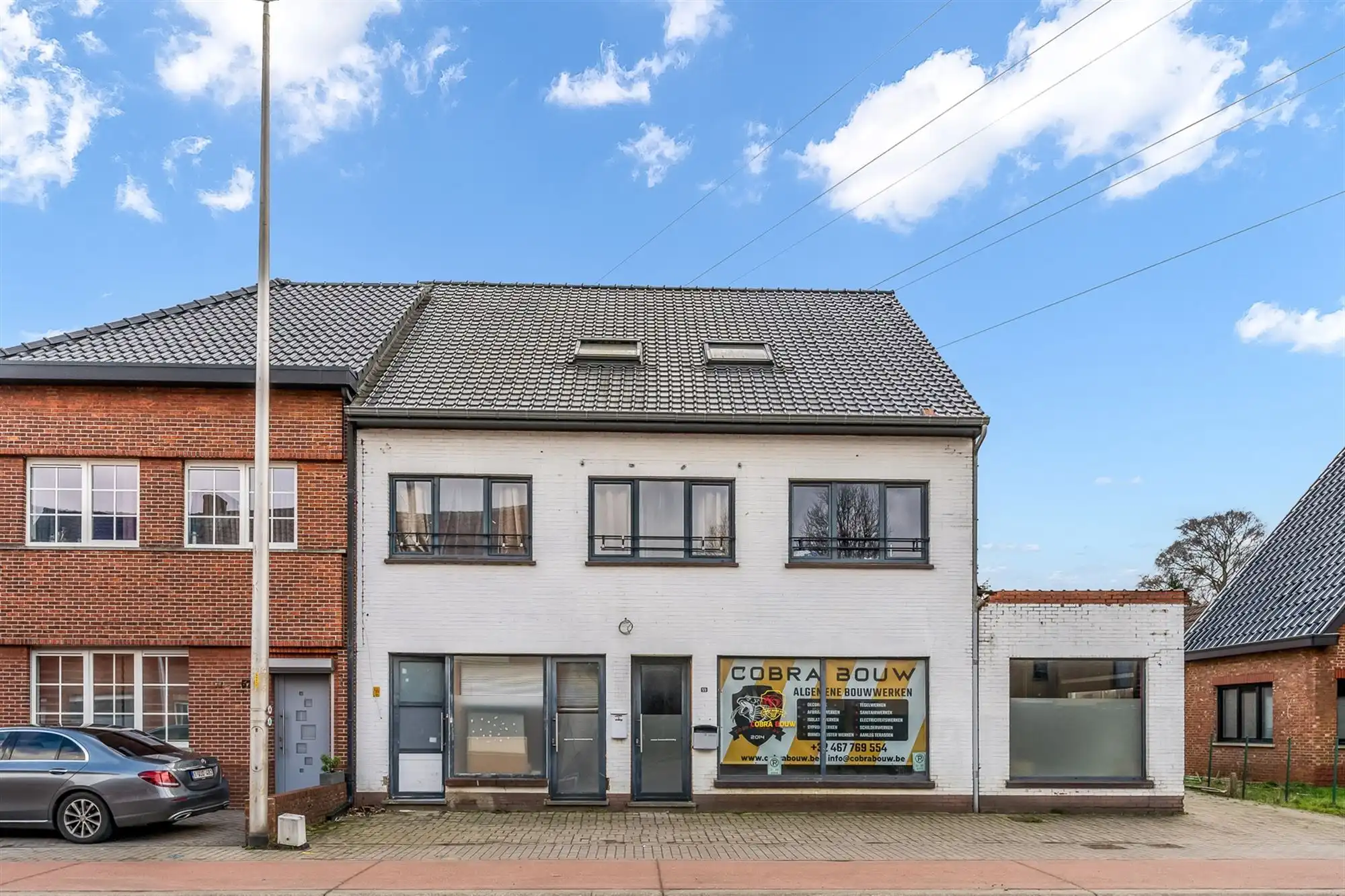 Hoofdfoto van de publicatie: HANDELSHUIS MET RUIM HANDELSPAND EN 2 WOONENTITEITEN OP PERCEEL VAN 9A68CA TE KOERSEL