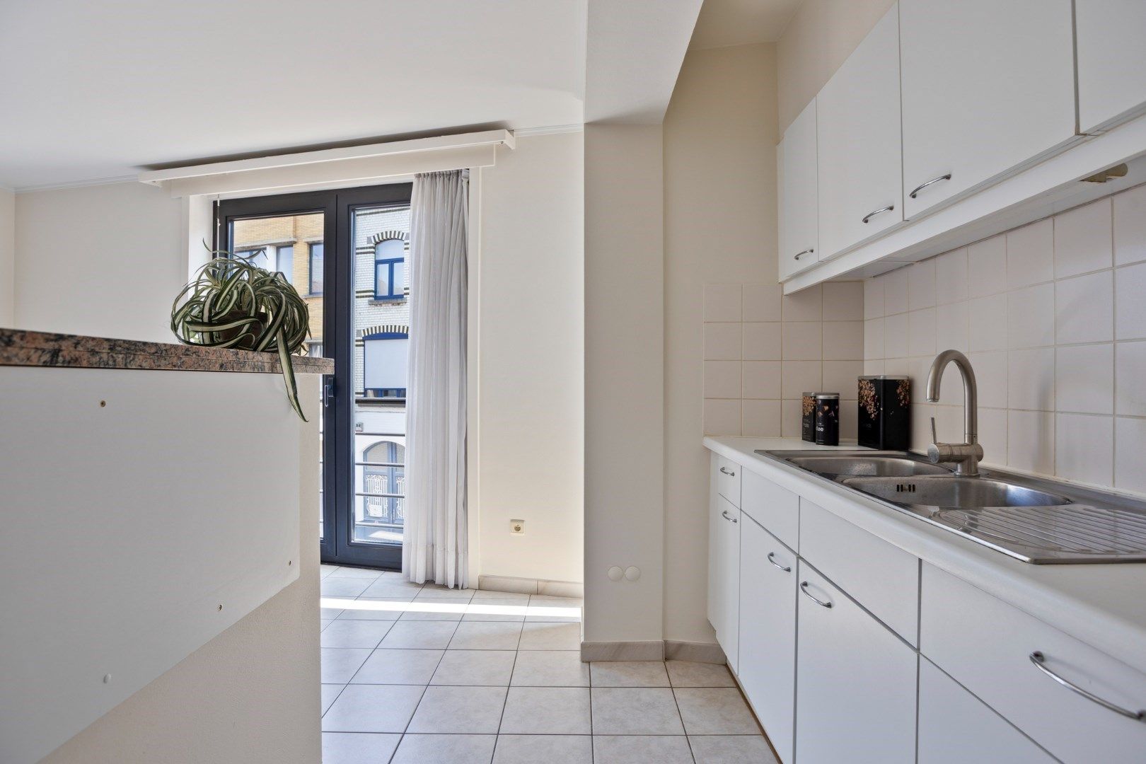 Mooi 2-slaapkamerappartement in hartje Menen! foto 9