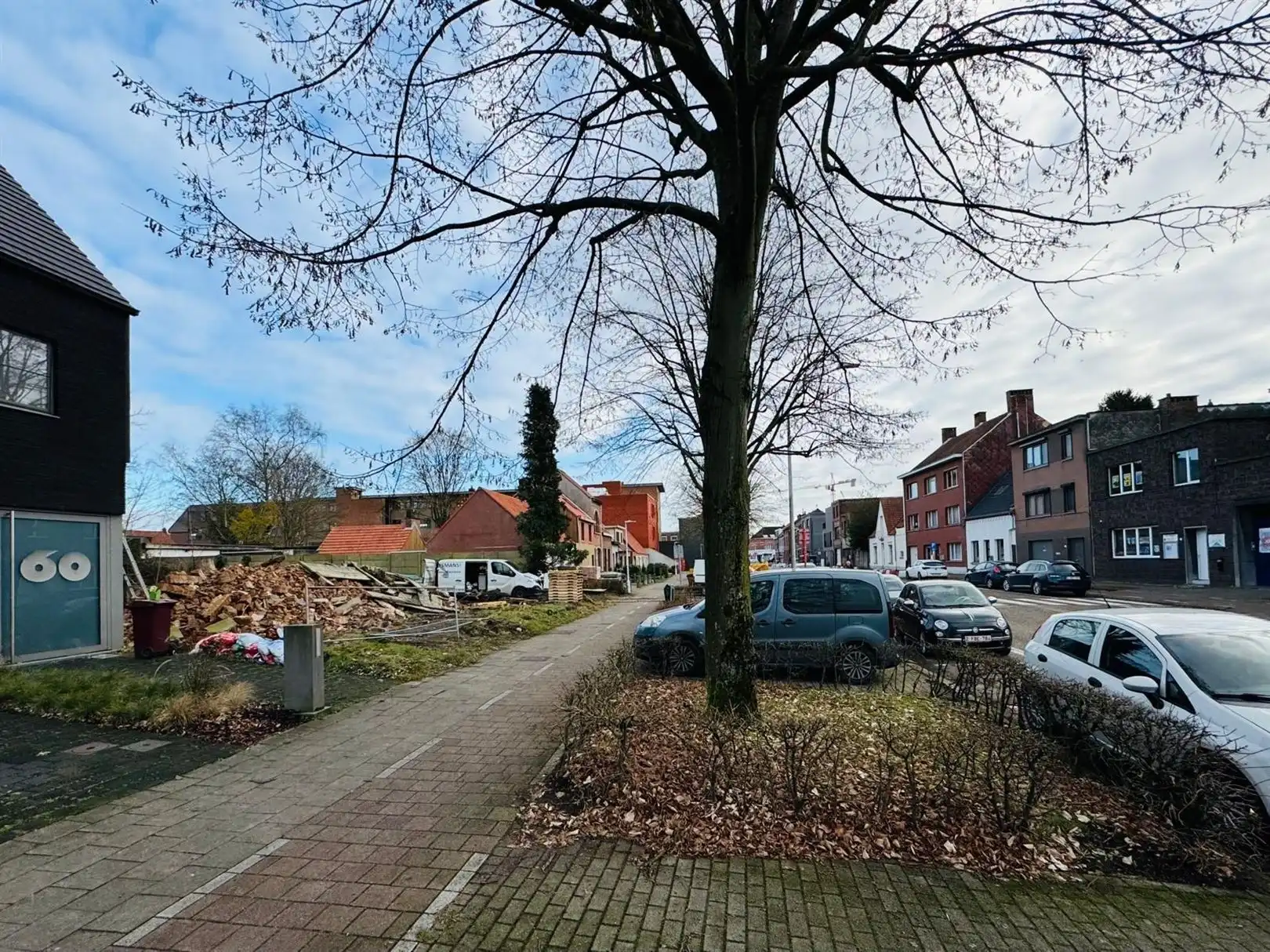 Grote half open bouwgrond in hartje Schoten foto 7