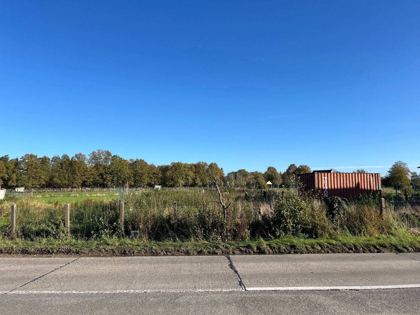 Bouwgrond voor OB (1.235m²) met achteraan agrarisch gebied foto 3