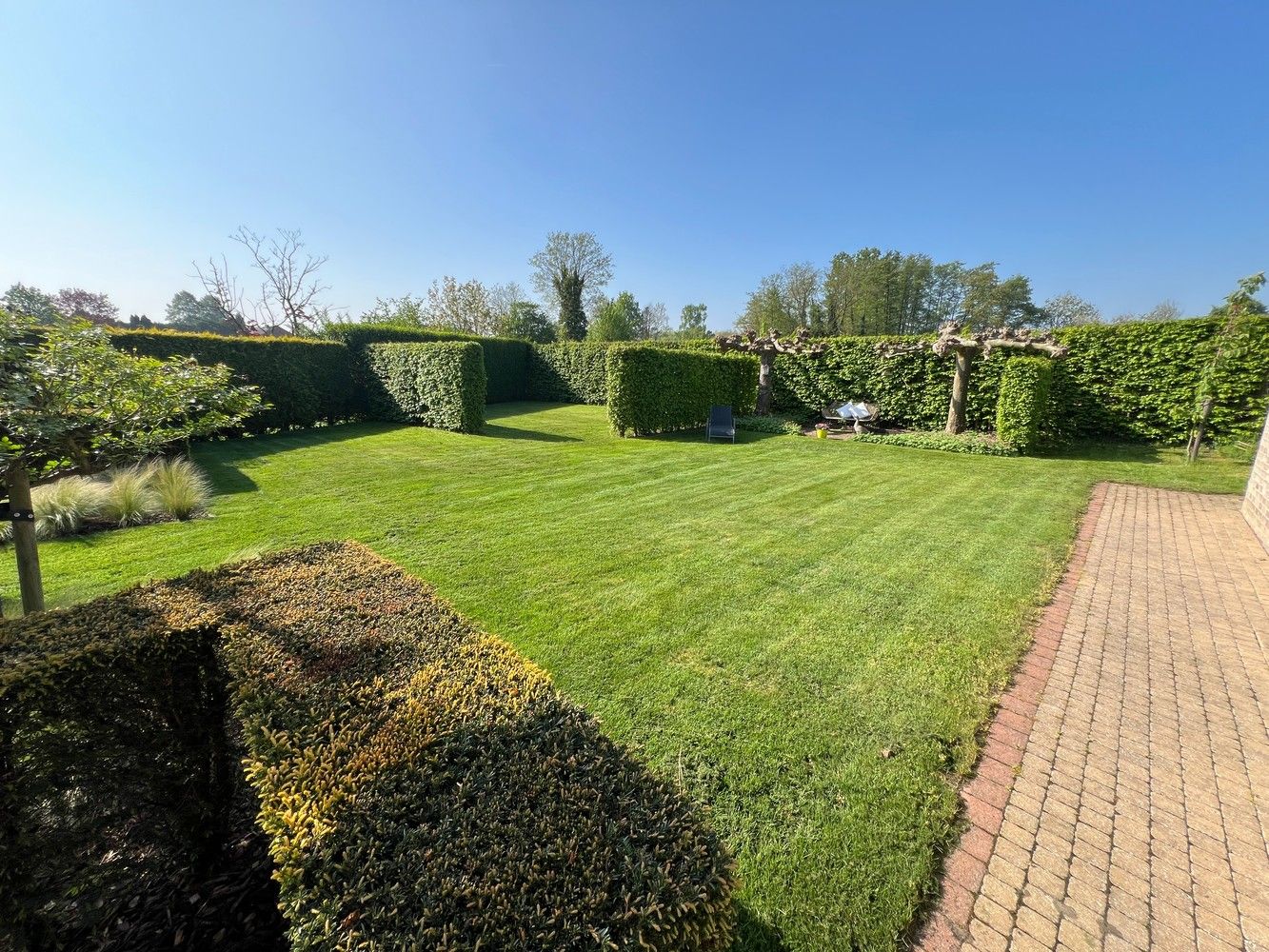 Luxueus gelijkvloers appartement met 3 slaapkamers, tuin en garage foto 22