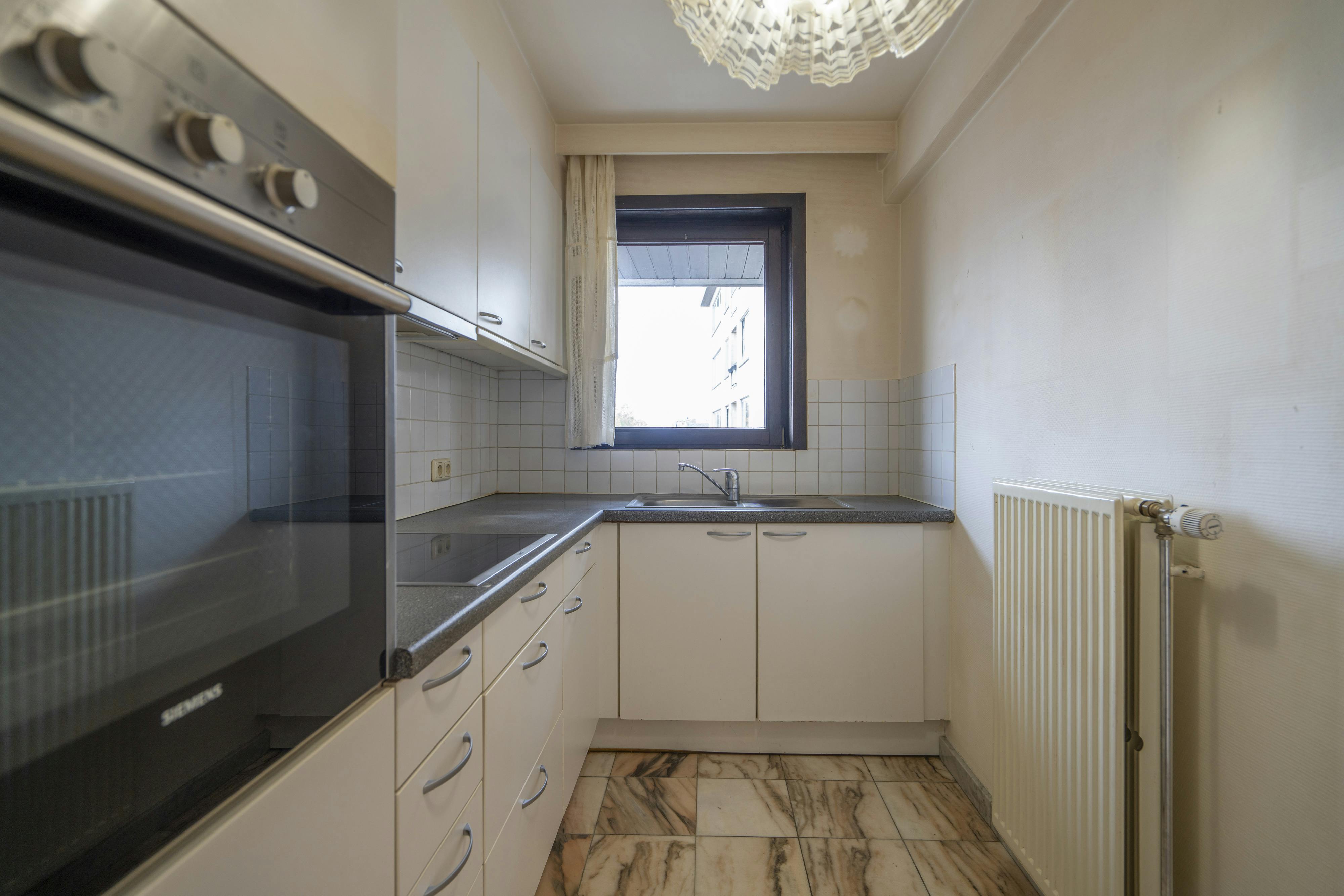 Te koop: lichtrijk 2-slaapkamerappartement in Kortrijk foto 6