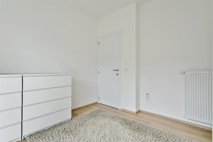 Gelijkvloers appartement met terras en tuintje foto 17