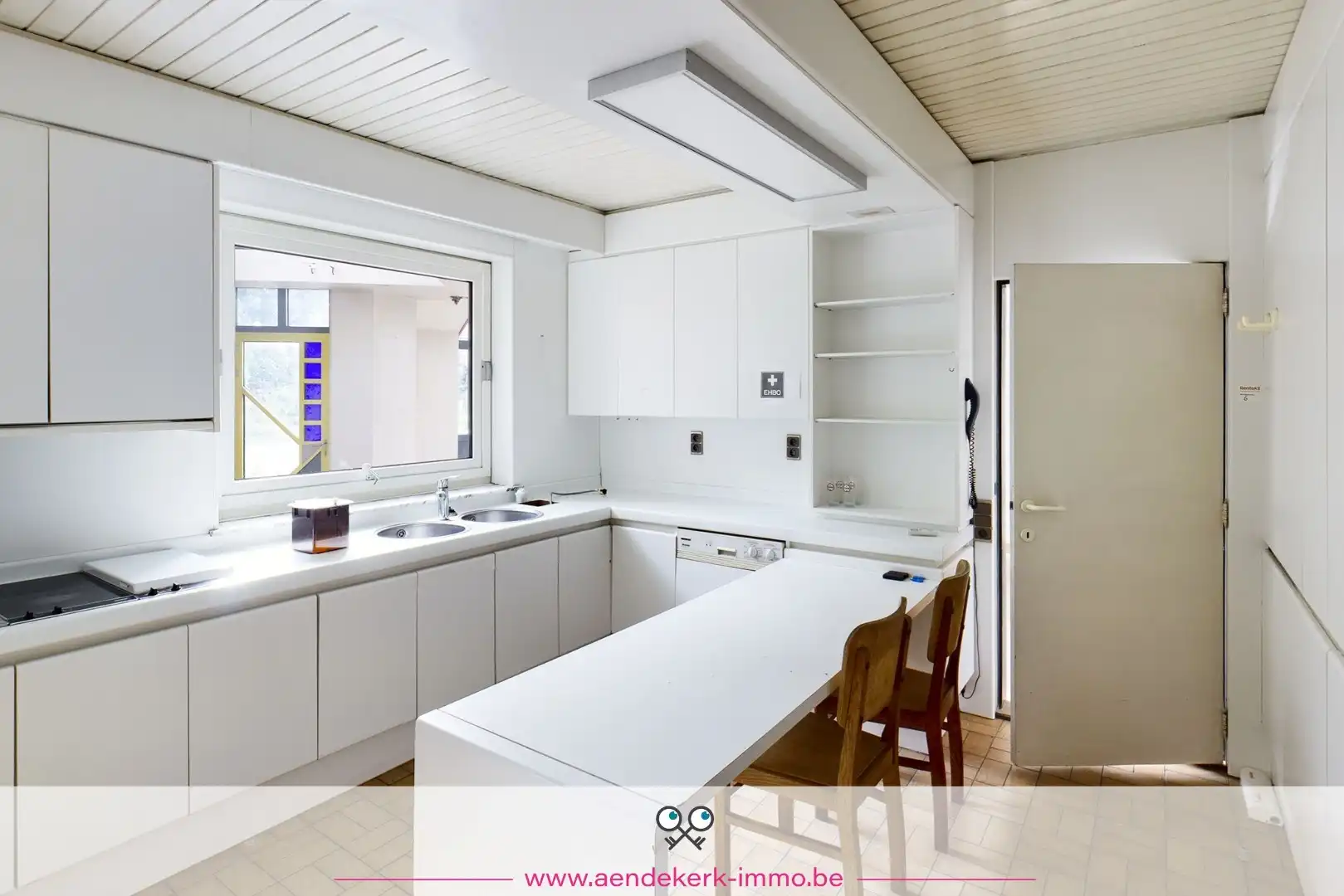 Woning met handelsruimte in het centrum van Kinrooi foto 17