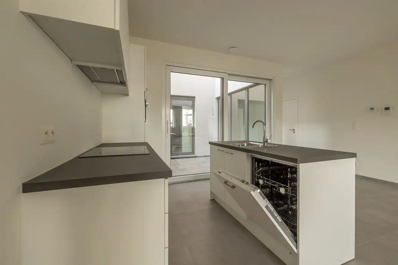 Nieuwbouwappartement met 1 slpk, autostaanplaats en terras foto 7