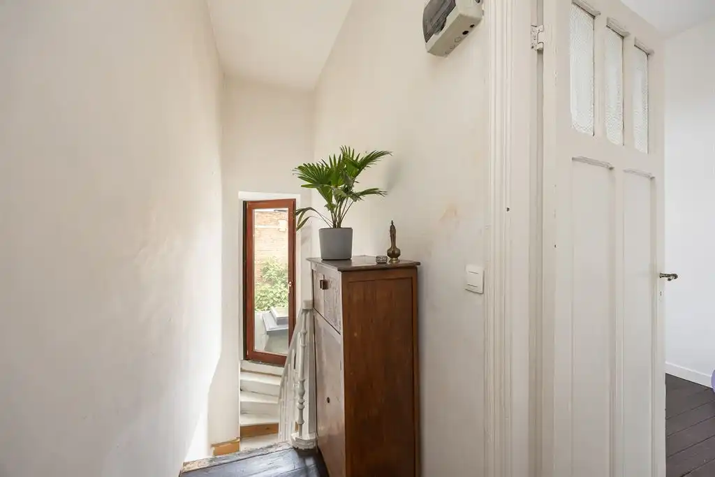 Karaktervolle gezinswoning met  groene stadstuin foto 21