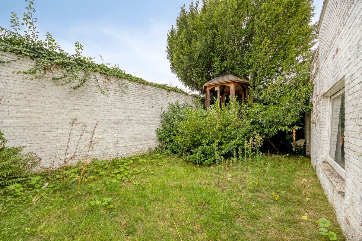 Karaktervolle stadswoning met handelsruimte, tuin en ruime garage in hartje Tongeren foto 21