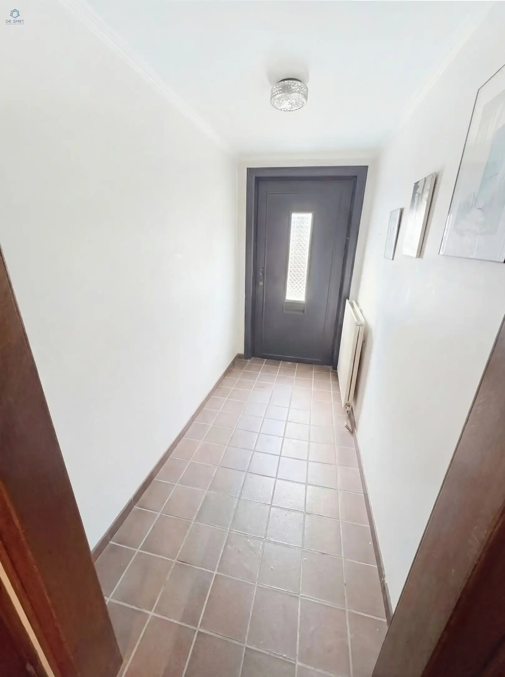 Te renoveren woning met 4 slaapkamers, garage en tuin op toplocatie in Denderleeuw foto 2