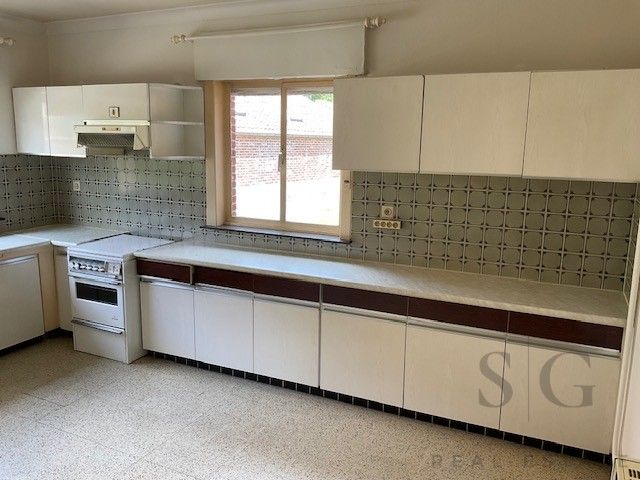 Te renoveren vrijstaande woning op ruim perceel tussen Bocholt en Bree – rust en potentieel op meer dan 32 are foto 3