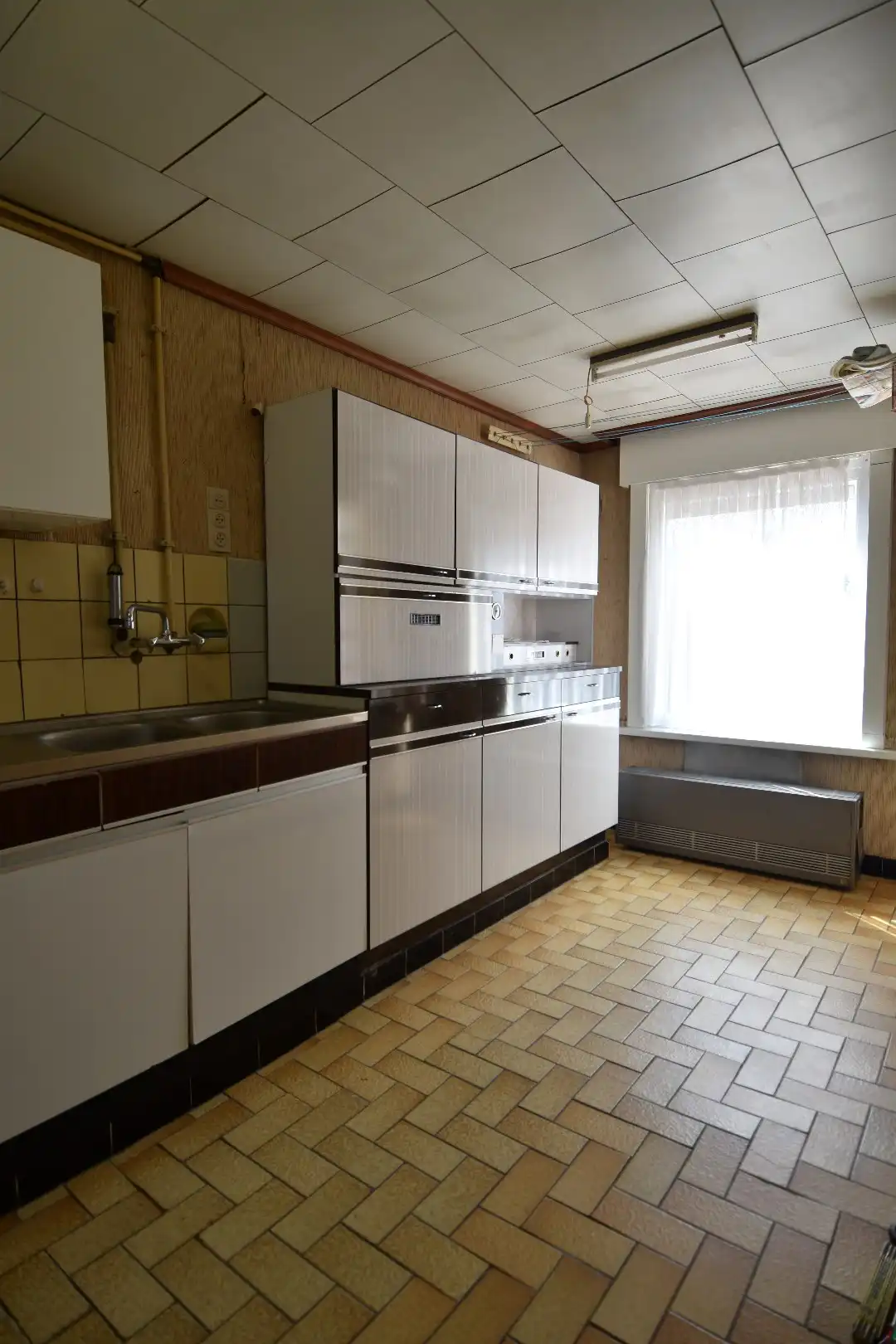 Woning met veel potentieel, garage en charmante tuin te koop in Kuurne foto 3