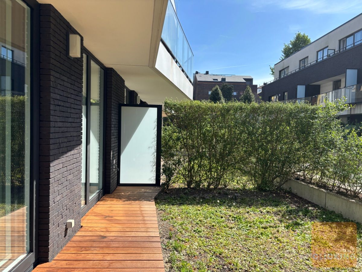 Tof 1 slaapkamerappartement met terras en tuintje foto 7
