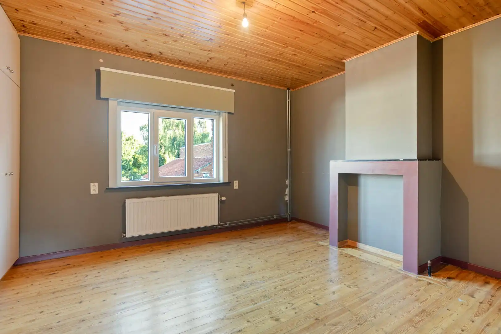Verzorgde woning met diepe tuin, carport en uitweg achteraan! foto 11