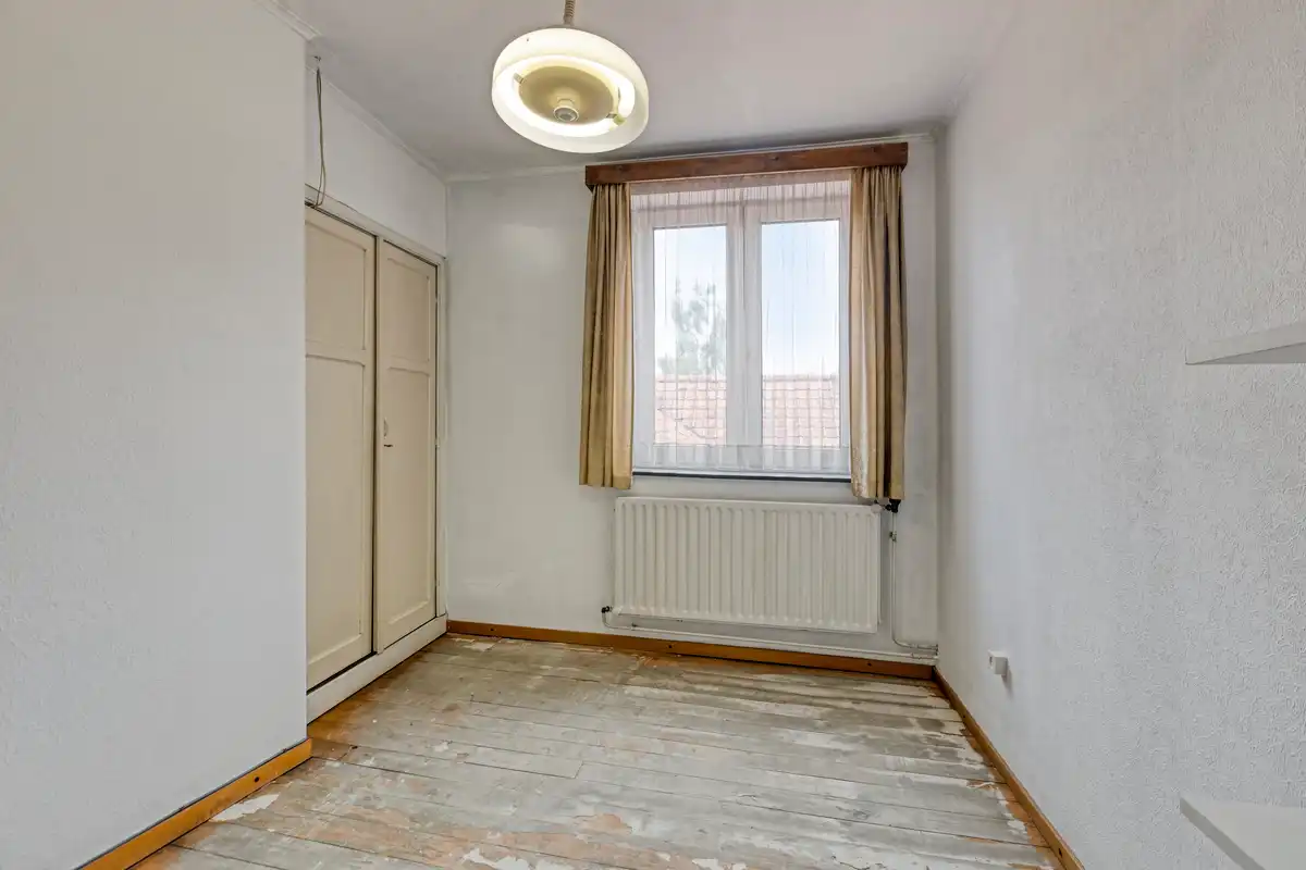 Te renoveren rijwoning in hartje Bilzen foto 21