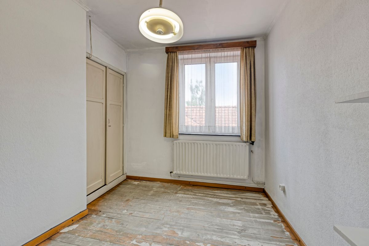 Te renoveren rijwoning in hartje Bilzen foto 21
