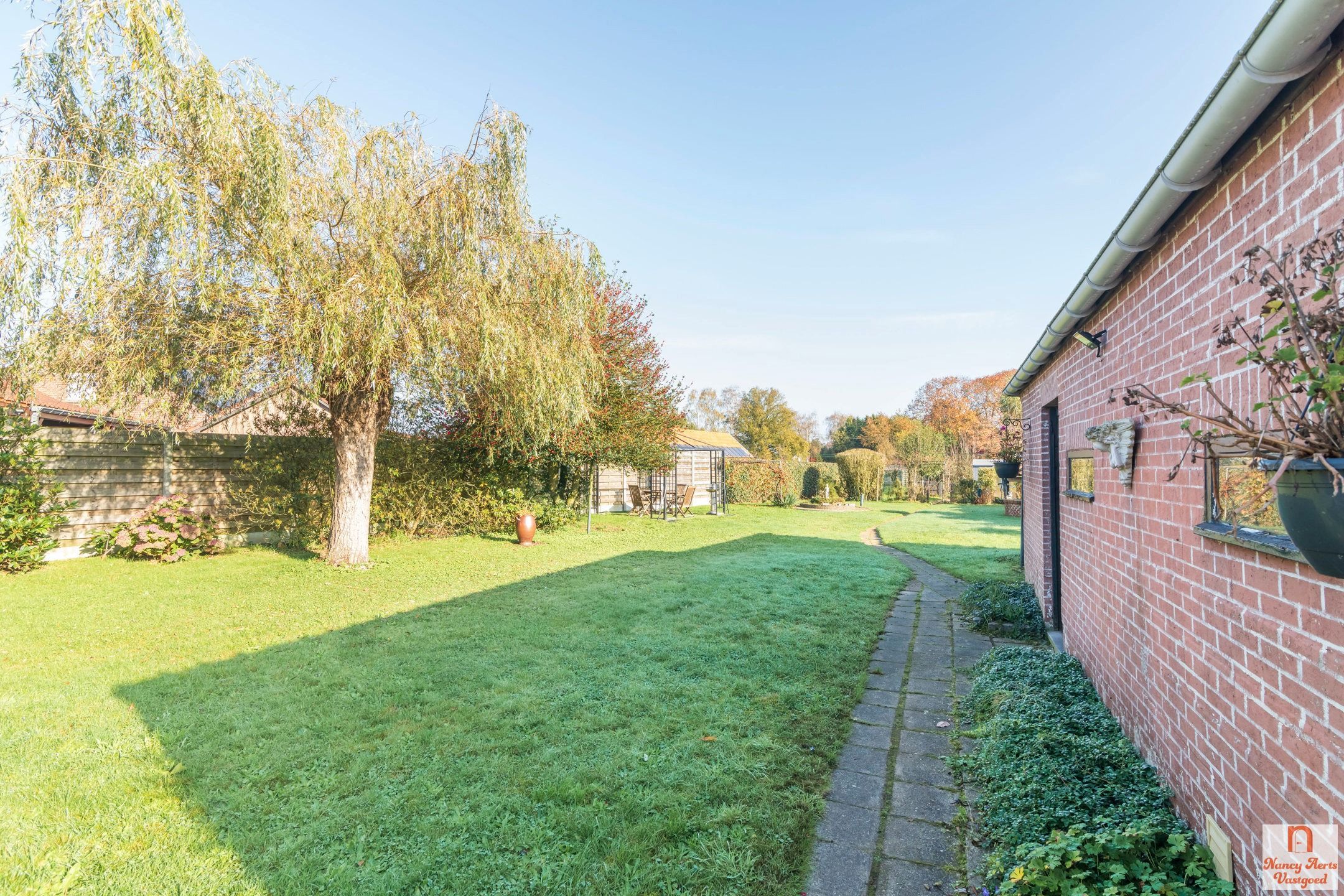 Sfeervolle gezinswoning met zonnige tuin in Paal foto 31